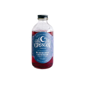 Bottle of Crescent Simples Blueberry Simple Syrup on a white background