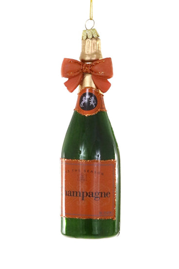 Decorative champagne bottle ornament with a bow on a white background