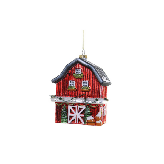 Red barn ornament with a black roof on a white background