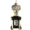 Decorative bottle opener ornament with gold and black design on a white background