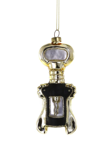 Decorative bottle opener ornament with gold and black design on a white background