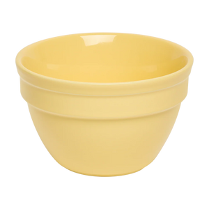 Yellow ceramic bowl on a white background