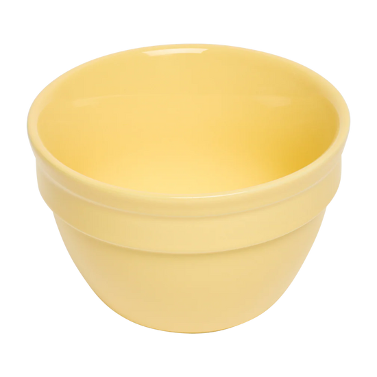 Yellow ceramic bowl on a white background
