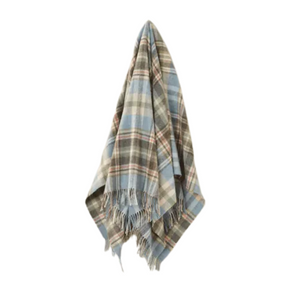 Plaid blanket with fringes on a white background