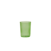 Green glass tumbler on a white background