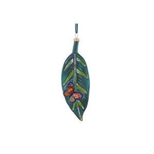 Decorative leaf ornament with a butterfly design on a white background