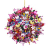 Colorful beaded ornament hanging against a white background
