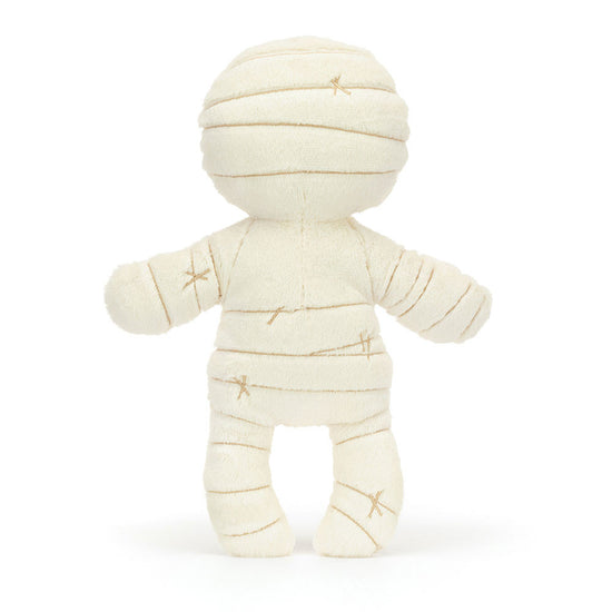 Toy mummy plush figure on a white background