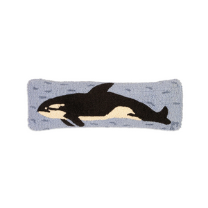 Knitted headband with an orca whale design on a white background