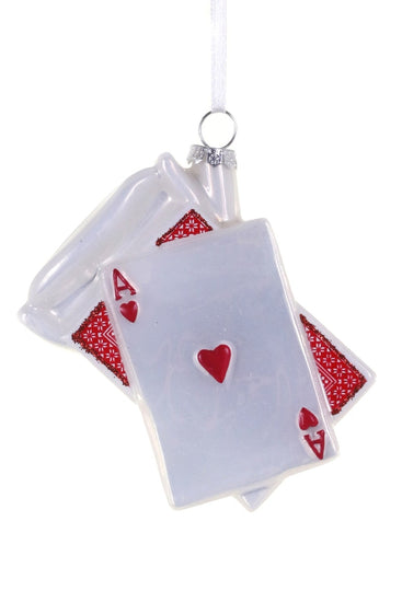 Playing card design ornament with red hearts on a white background