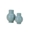 Two light blue ceramic vases on a white background