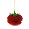 Decorative tomato ornament with green stem on a white background