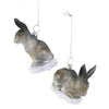 Two glass bunny ornaments, hanging against a white background.