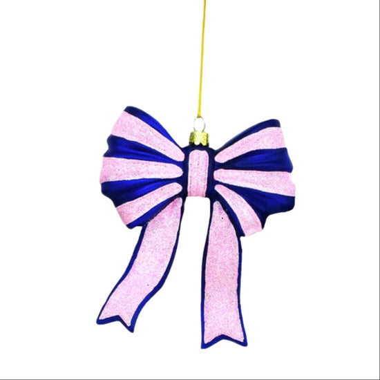 Decorative bow ornament with pink and blue colors on a white background