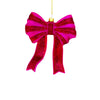 Red glittery bow ornament on a white background