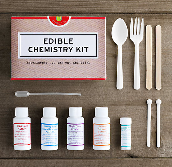 Everything included in the edible chemistry kit, laid out on a table.
